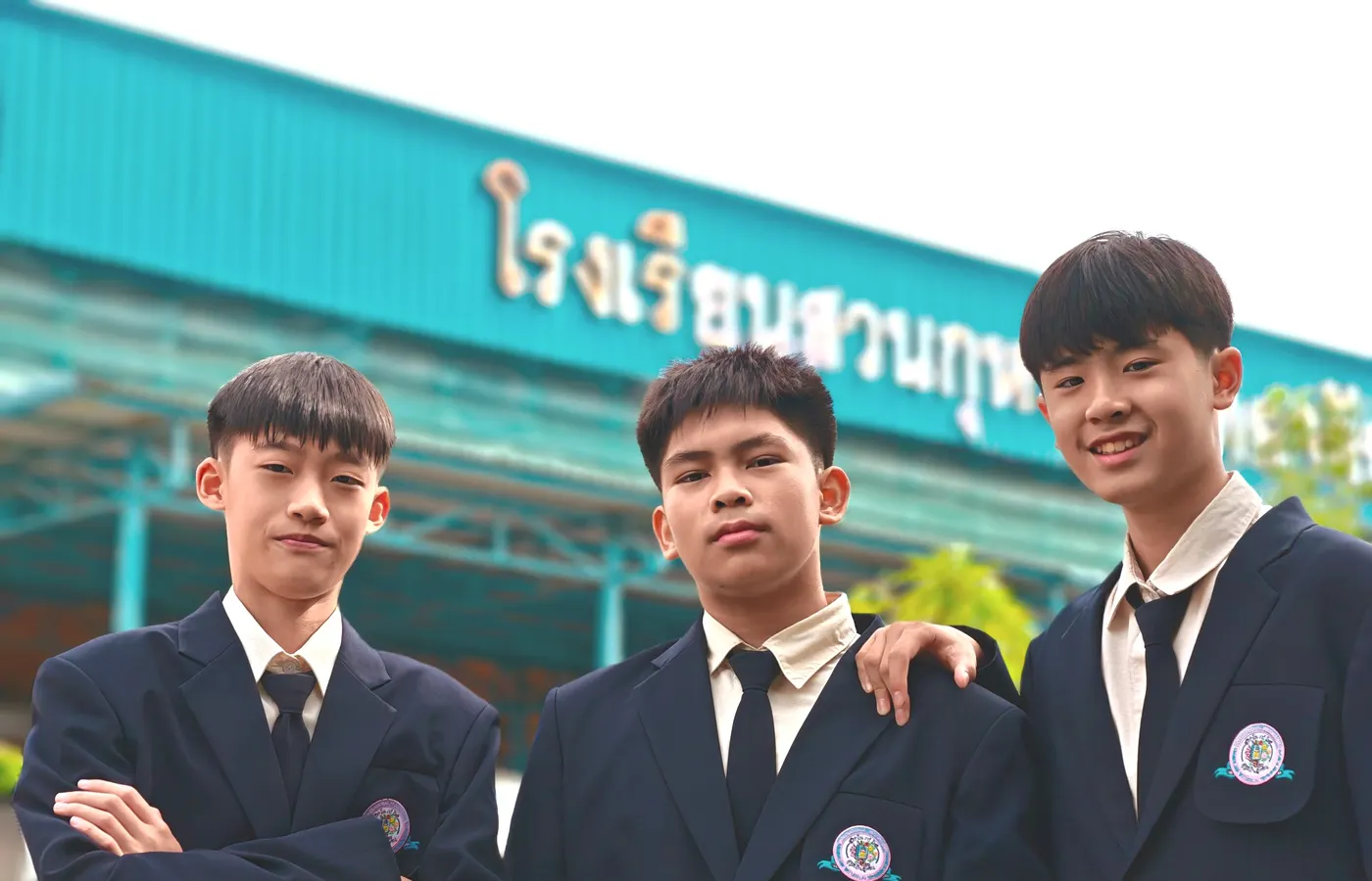 Three SKTIP students in school blazers